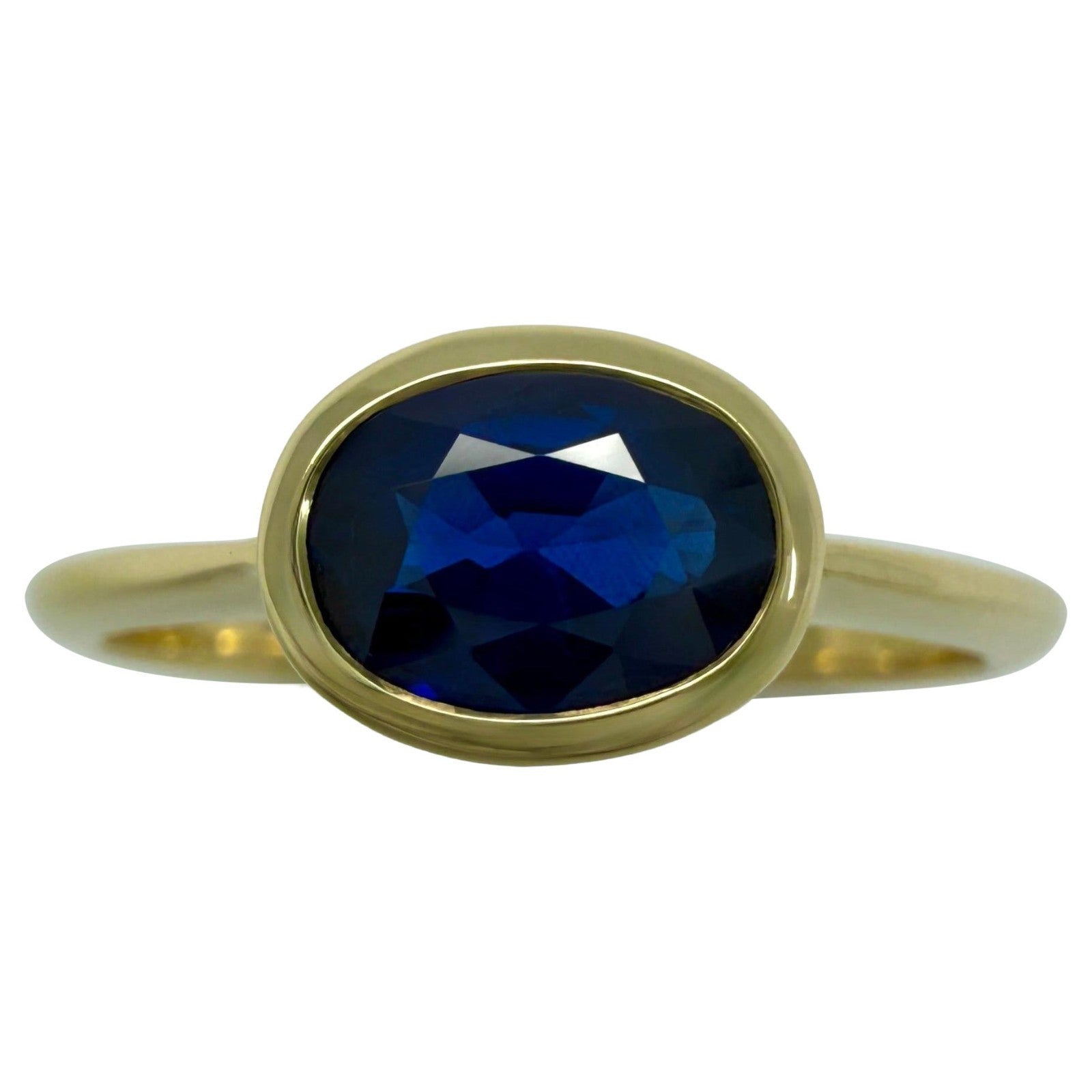 1.58ct Deep Royal Blue Oval Cut Sapphire 18k Yellow Gold Bezel East West Ring