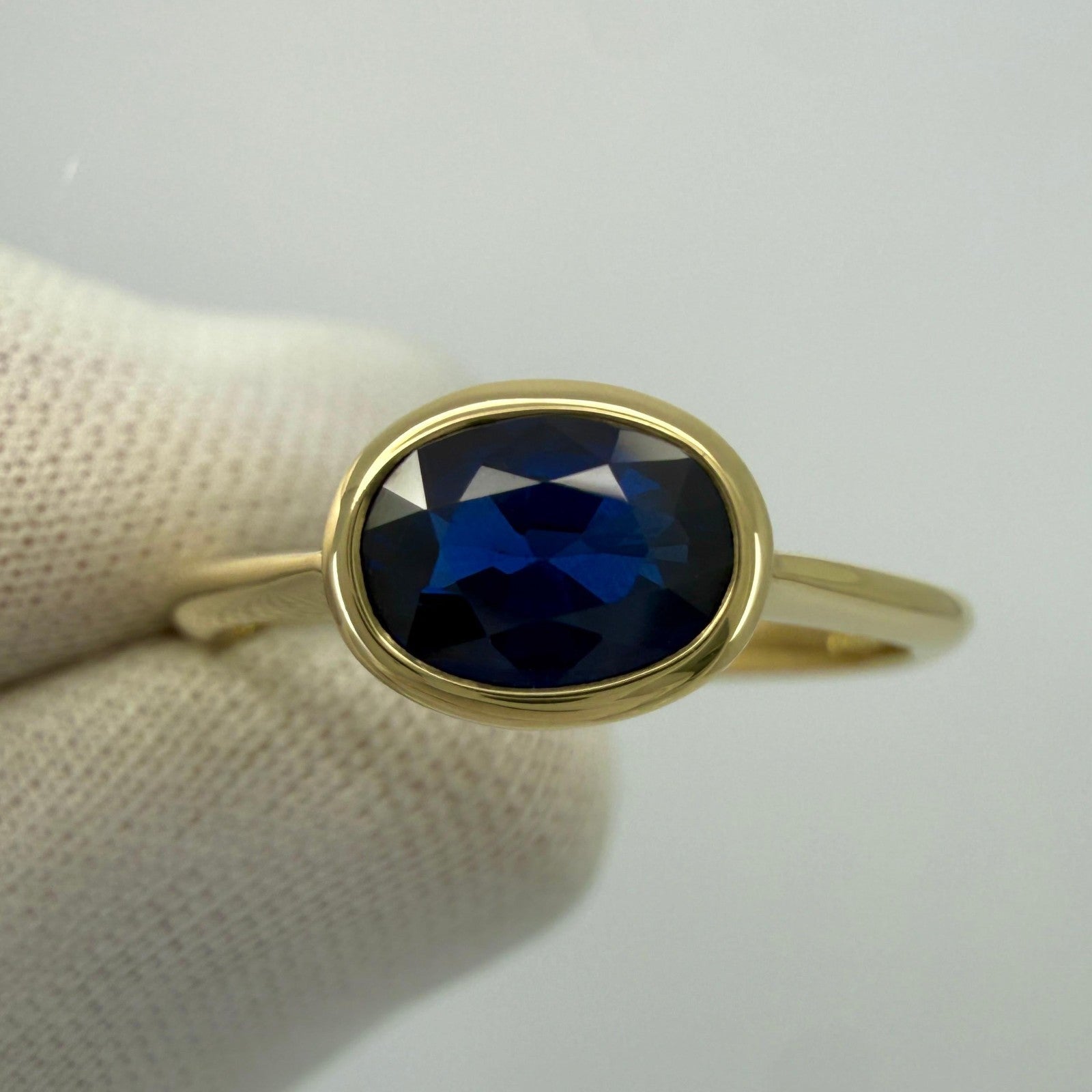 1.58ct Deep Royal Blue Oval Cut Sapphire 18k Yellow Gold Bezel East West Ring — view 2
