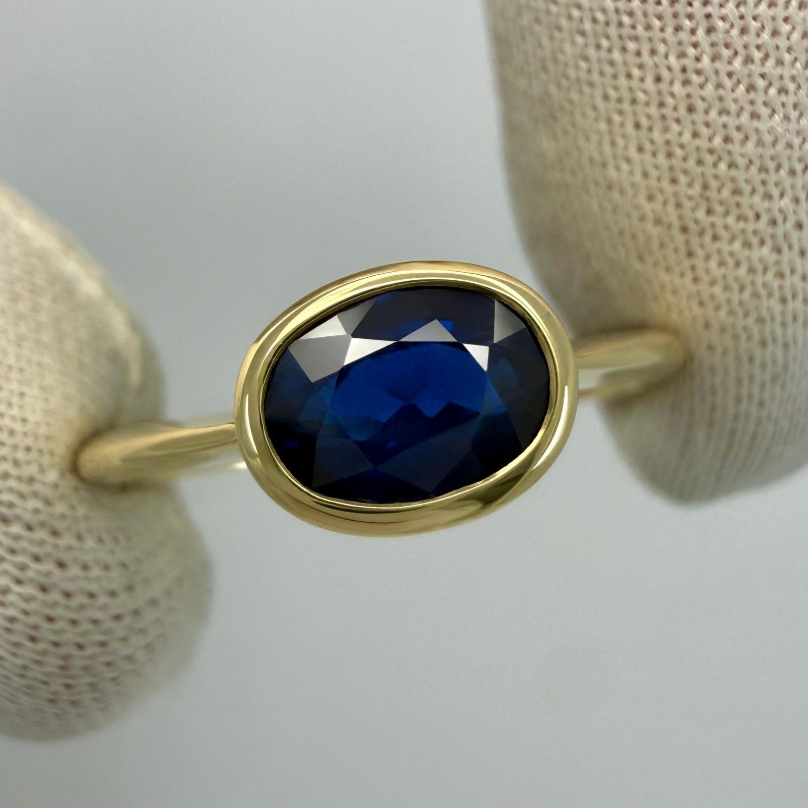 1.58ct Deep Royal Blue Oval Cut Sapphire 18k Yellow Gold Bezel East West Ring — view 3